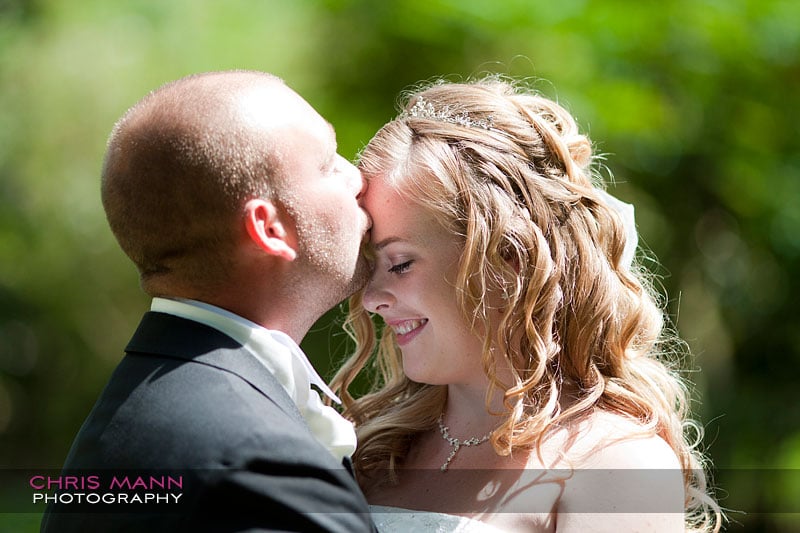a kiss for the bride - Libby and Paul's wedding at Cisswood House - photo by Chris Mann Photography a kiss for the bride - Libby and Paul's wedding at Cisswood House - photo by Chris Mann Photography
