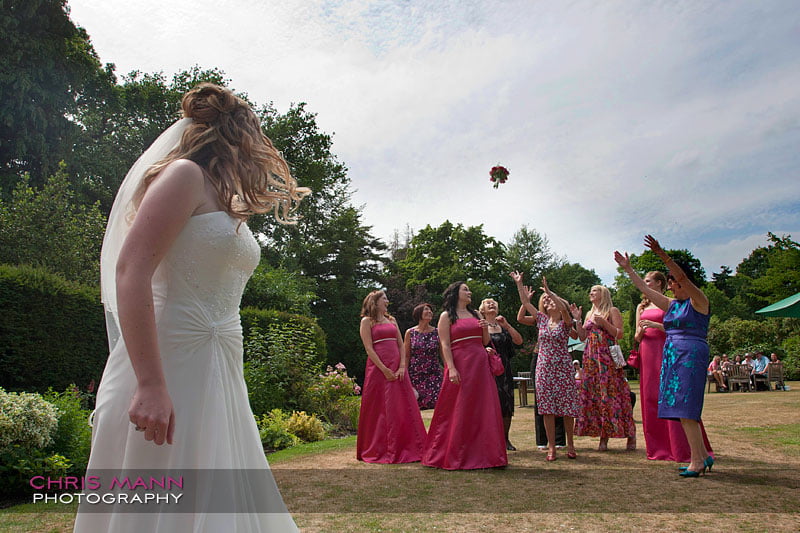 tossing the bouquet - Libby and Paul's wedding at Cisswood House - photo by Chris Mann Photography tossing the bouquet - Libby and Paul's wedding at Cisswood House - photo by Chris Mann Photography