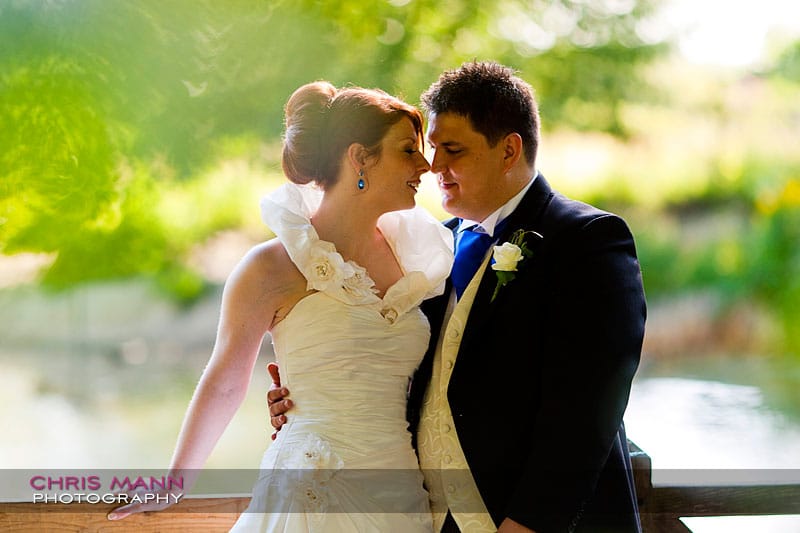 Kimberley & Richard at Bentley - bride and groom at railing by lake Kimberley & Richard at Bentley - bride and groom at railing by lake