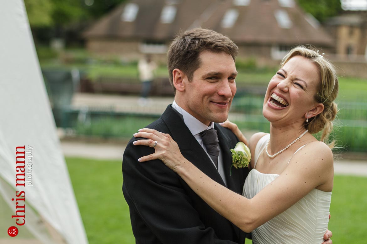 Orangery Holland Park Wedding laughing bride and happy groom