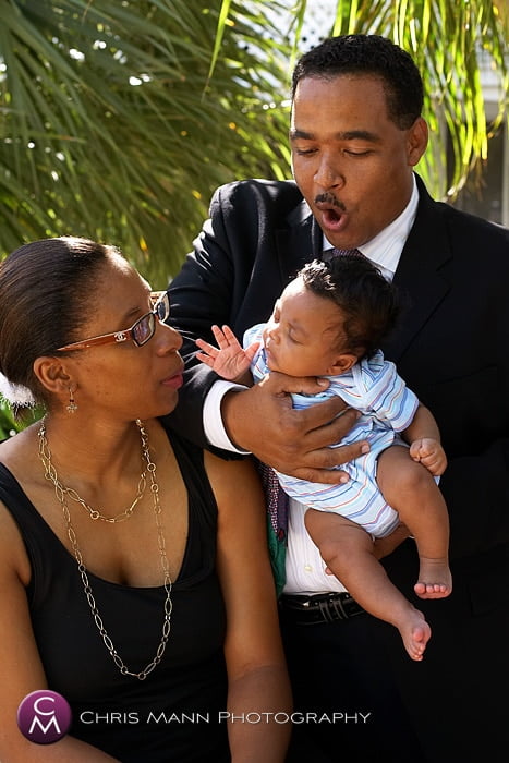 parents enjoying a family portrait session with their baby son
