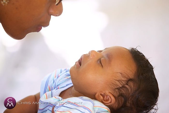 professional portrait of mother smiling at her baby son