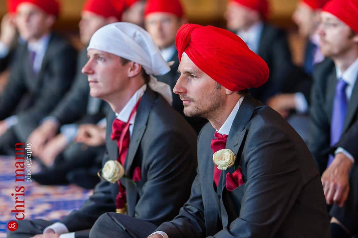 Groom and best man at Sikh wedding ceremony in gurdwara