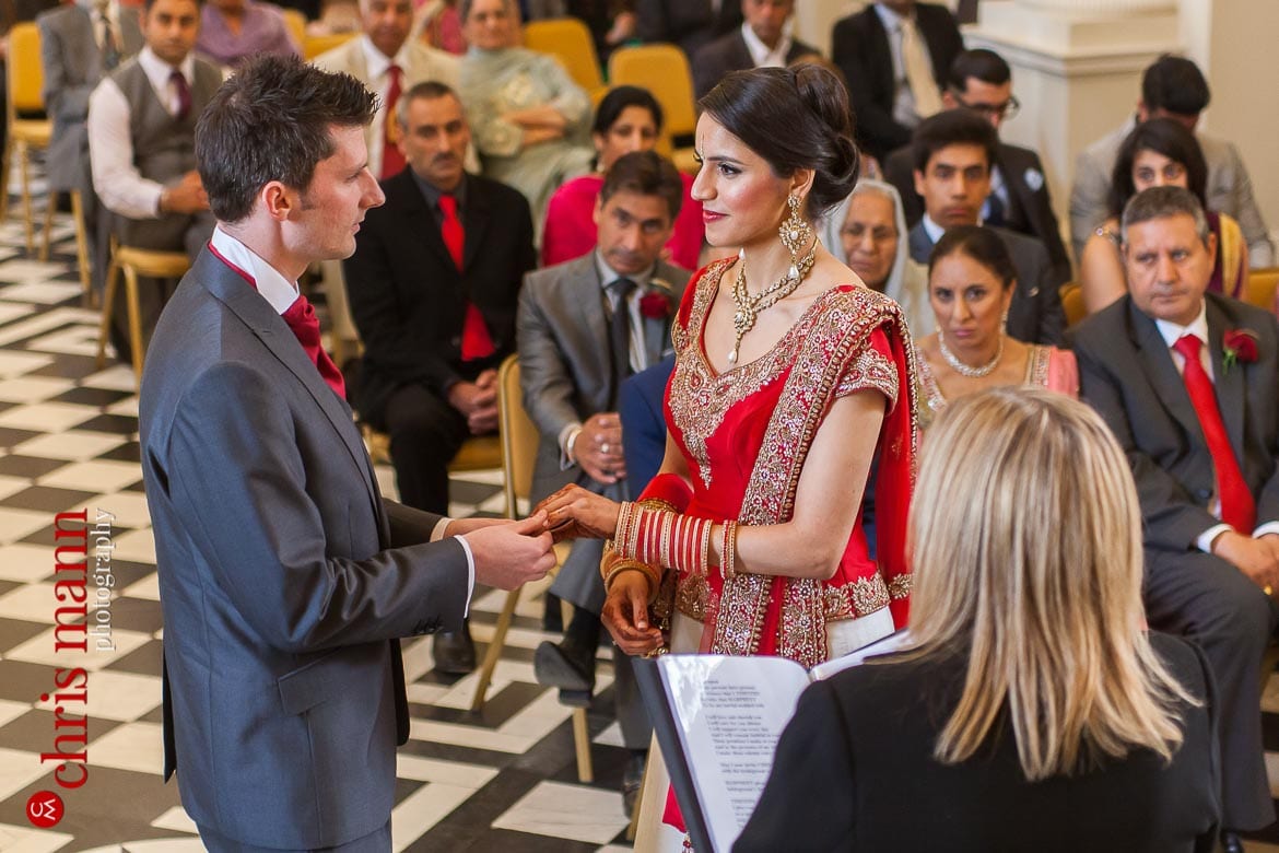 Syon Park wedding bride and groom exchange rings Syon House civil ceremony