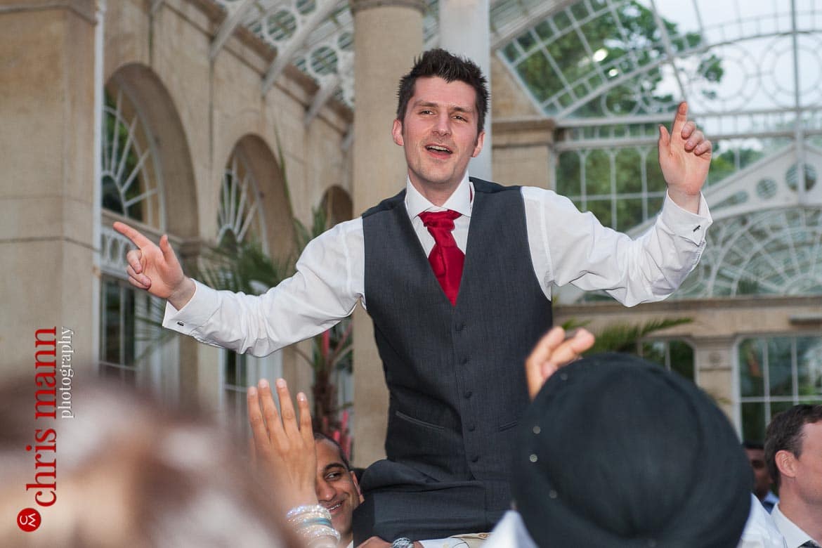 groom dancing at reception Syon Park Great Conservatory