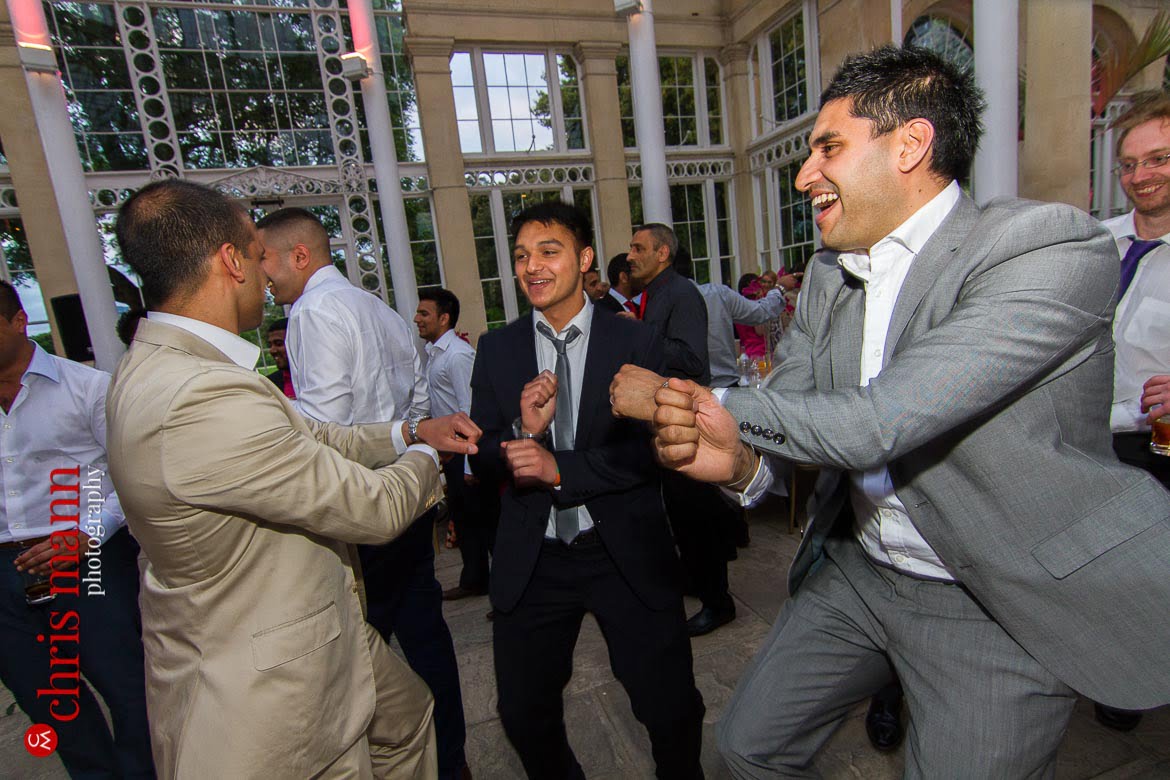 guests dance gangnam style at reception Syon Park Great Conservatory