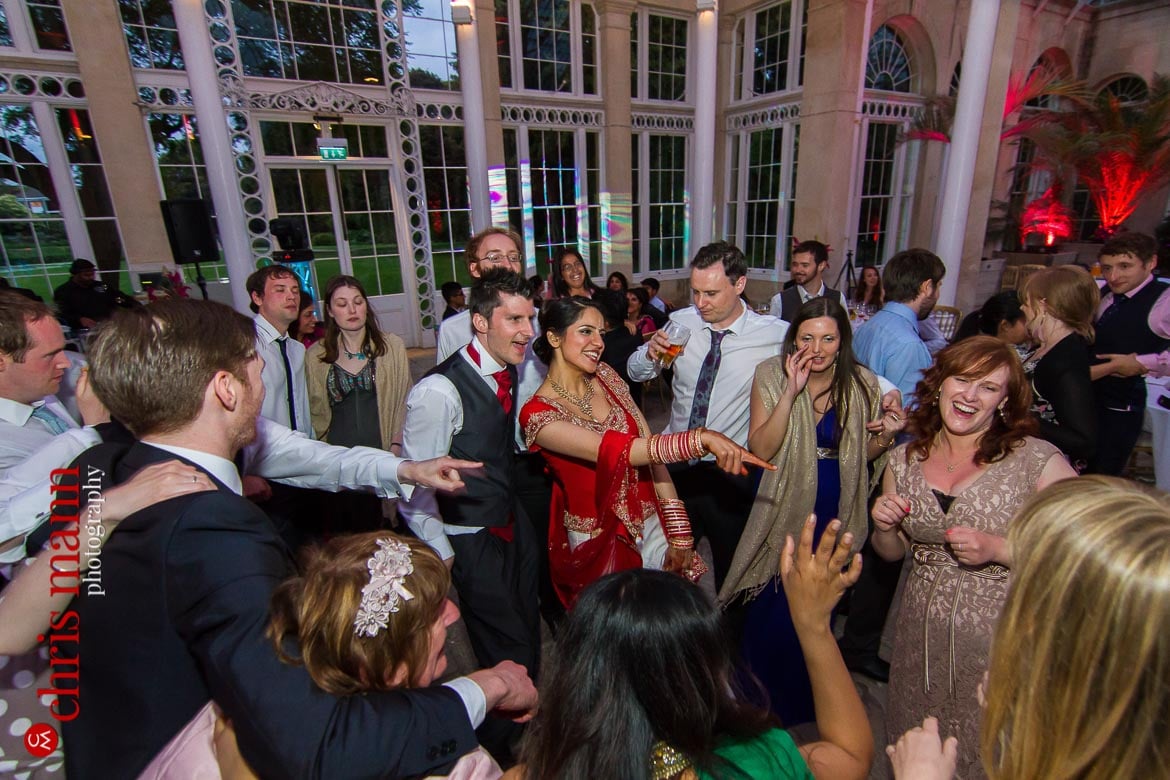 bride groom and guests dancing at reception Syon Park Great Conservatory