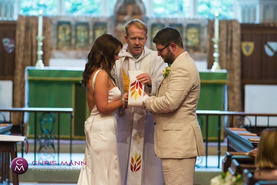 minister blesses couple wedding st nicolas cranleigh Surrey church wedding