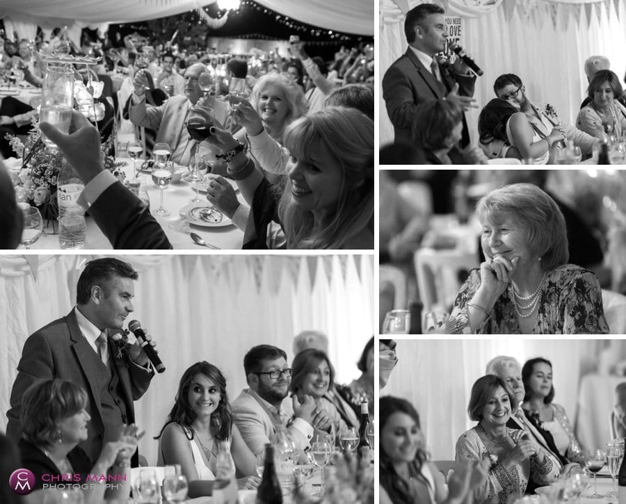speeches and clapping guests maquee wedding reception surrey