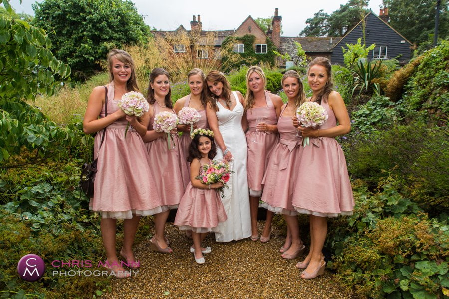 group photo bride with bridesmaids in garden