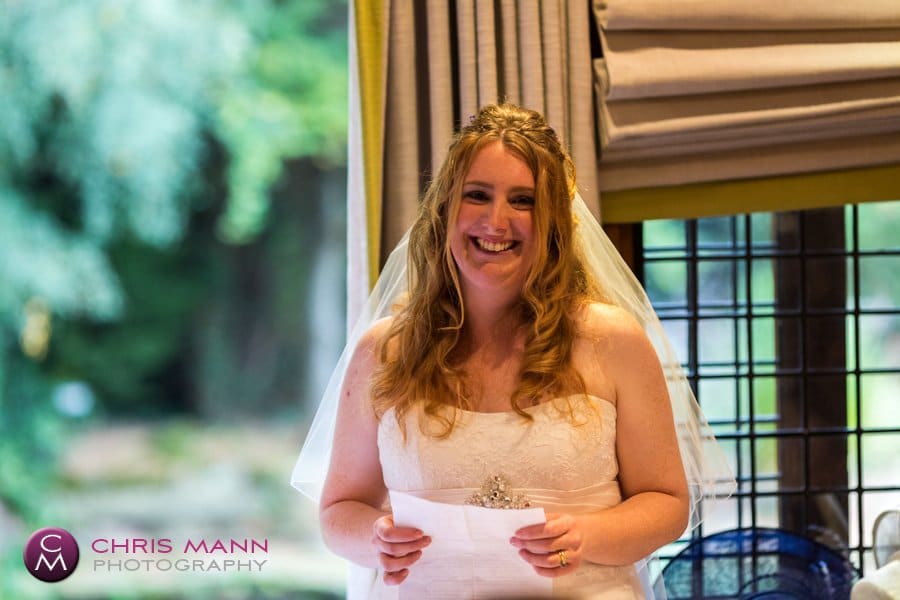bride gives speech at wedding reception