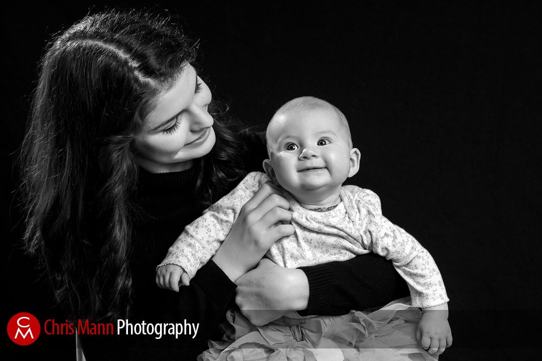 sister with new baby portrait