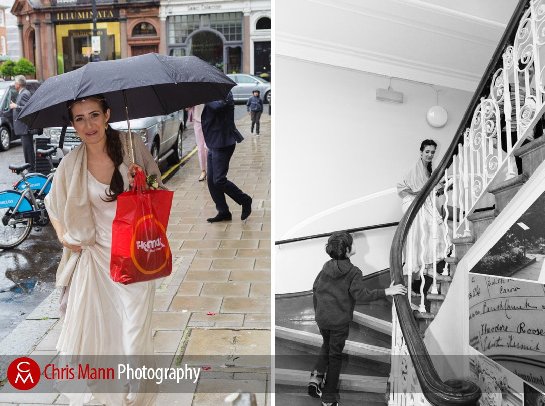 bride arrives with umbrella held high for her wedding