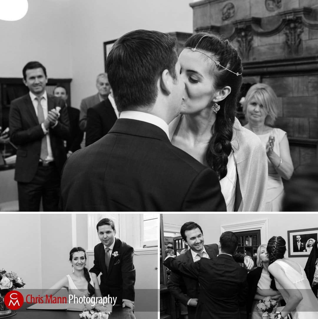 first kiss and signing the register - Mayfair Library wedding