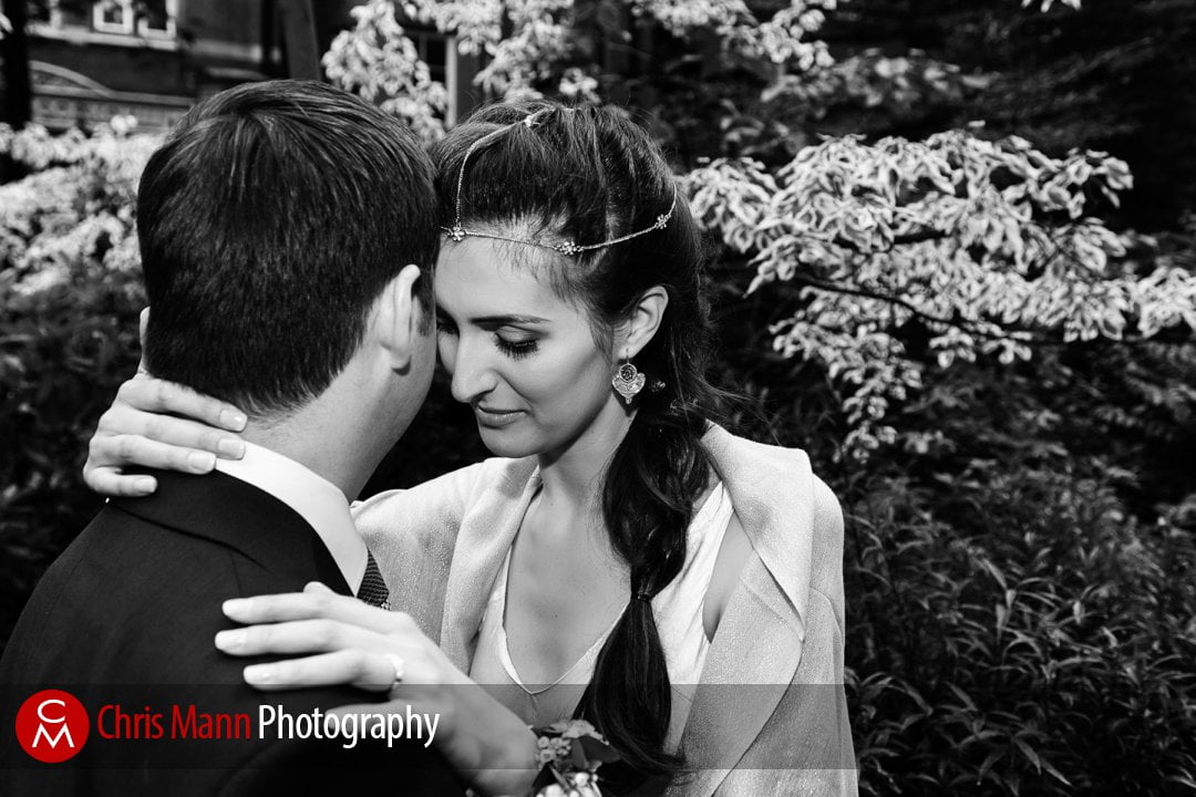 bride and groom embrace in Mount Street Gardens