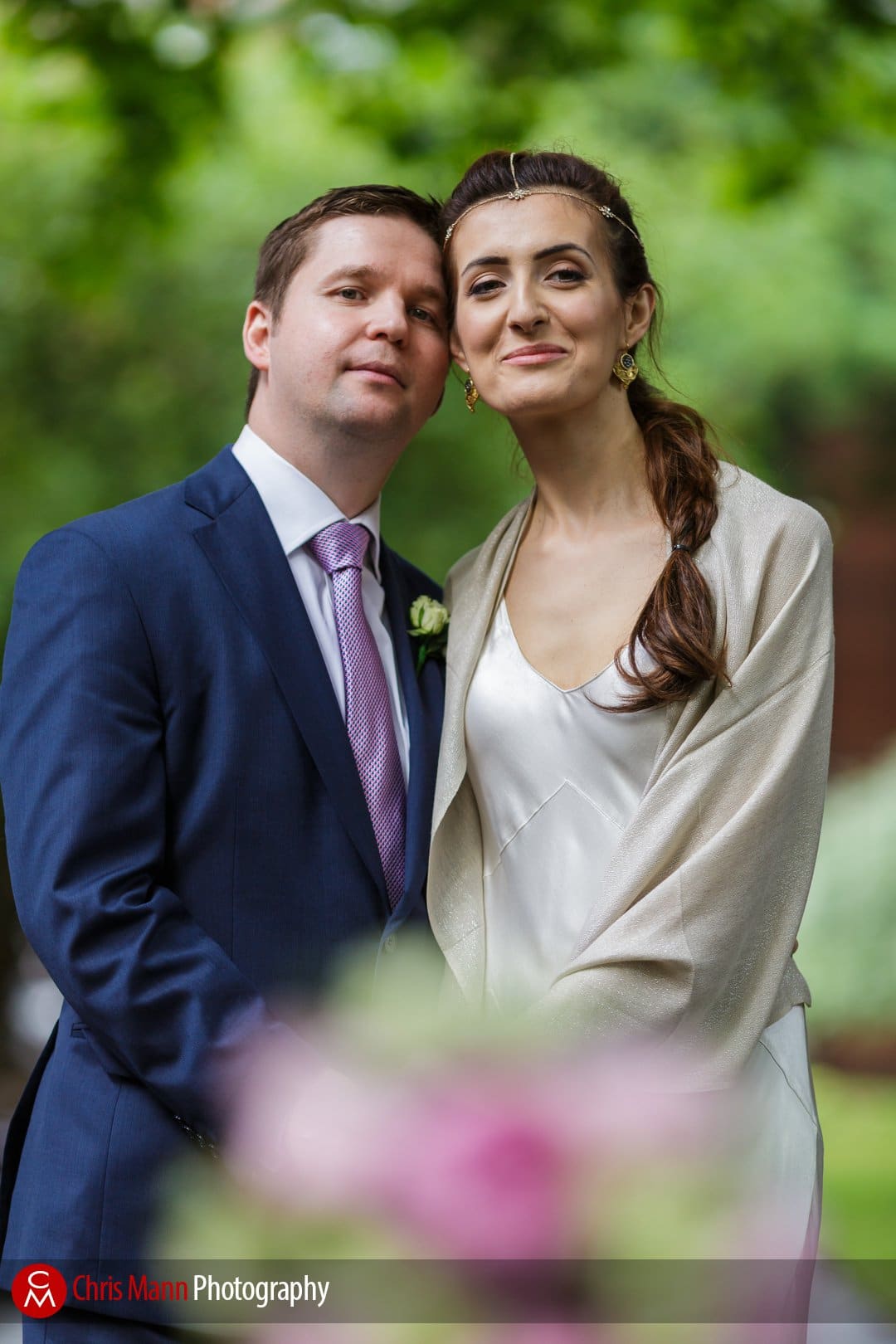 bride and groom smile for the camera