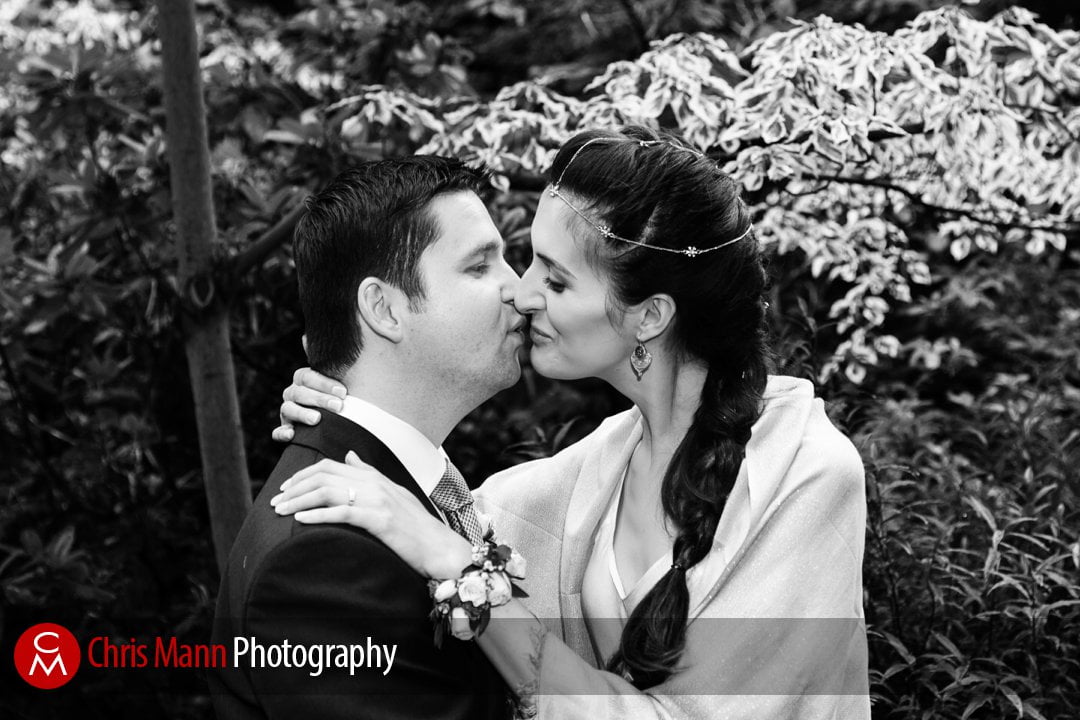 happy couple just married kiss in Mount Street Gardens