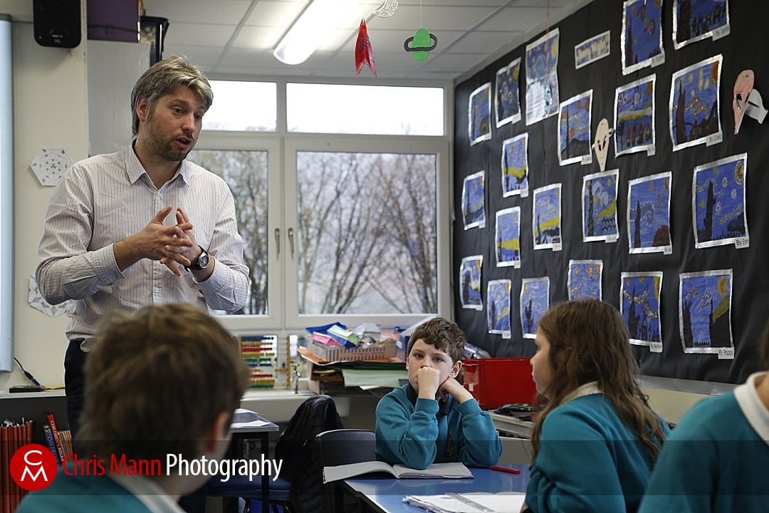 teacher talking to pupils