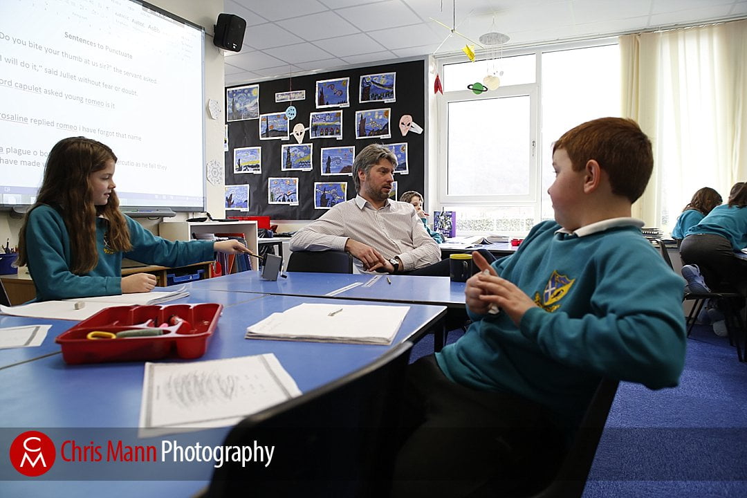 teacher and pupils in classroom