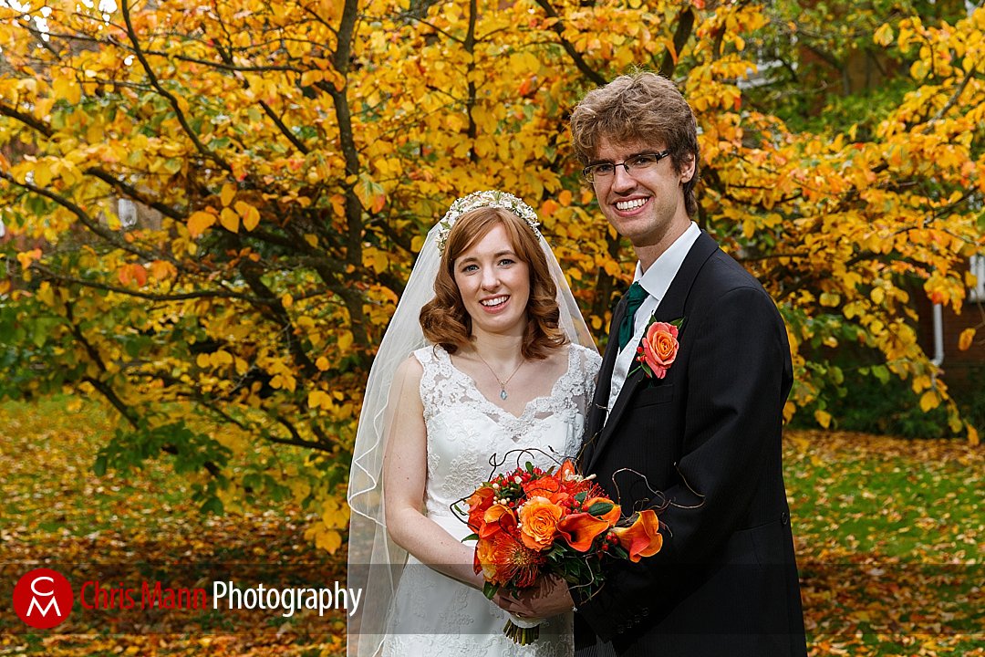 bride and groom autumn leaves fall Lady Margaret Hall Oxford