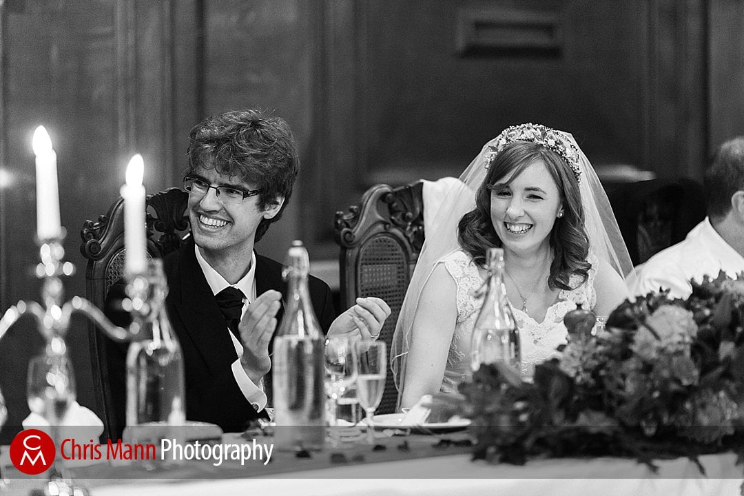 bride and groom listen to speeches Lady Margaret Hall Oxford