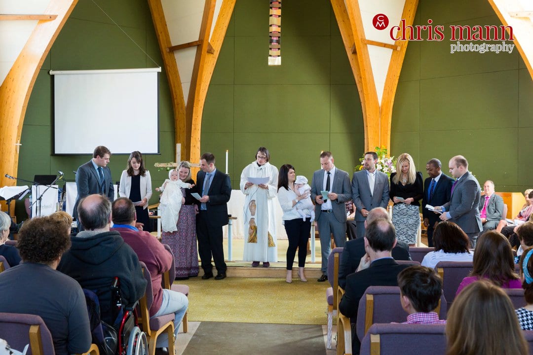 christening service in progress at St. Peter's Church Bellfields