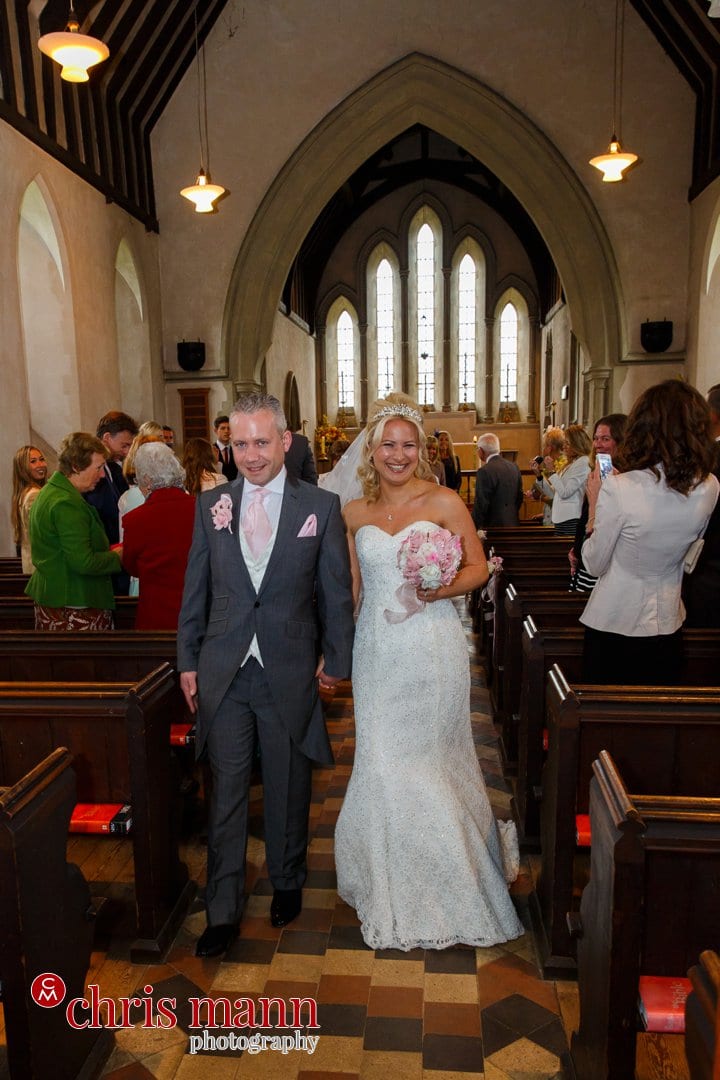 bride and groom recessional t Luke's Church Burpham Guildford Surrey