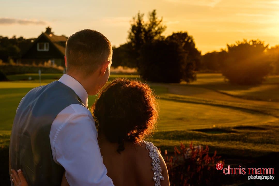 sunset photo bride and groom looking at sunset Surrey Downs Golf Club