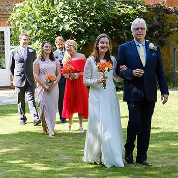 bride with father wedding party walk down for outdoor wedding surrey UK 