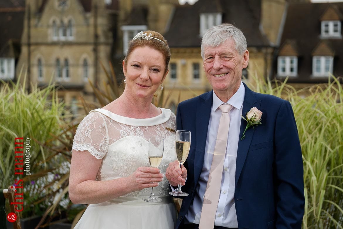 bride and groom couple portrait on roof of Ashmolean Museum Oxford