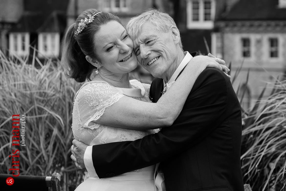 bride and groom embrace couple portrait on roof of Ashmolean Museum Oxford