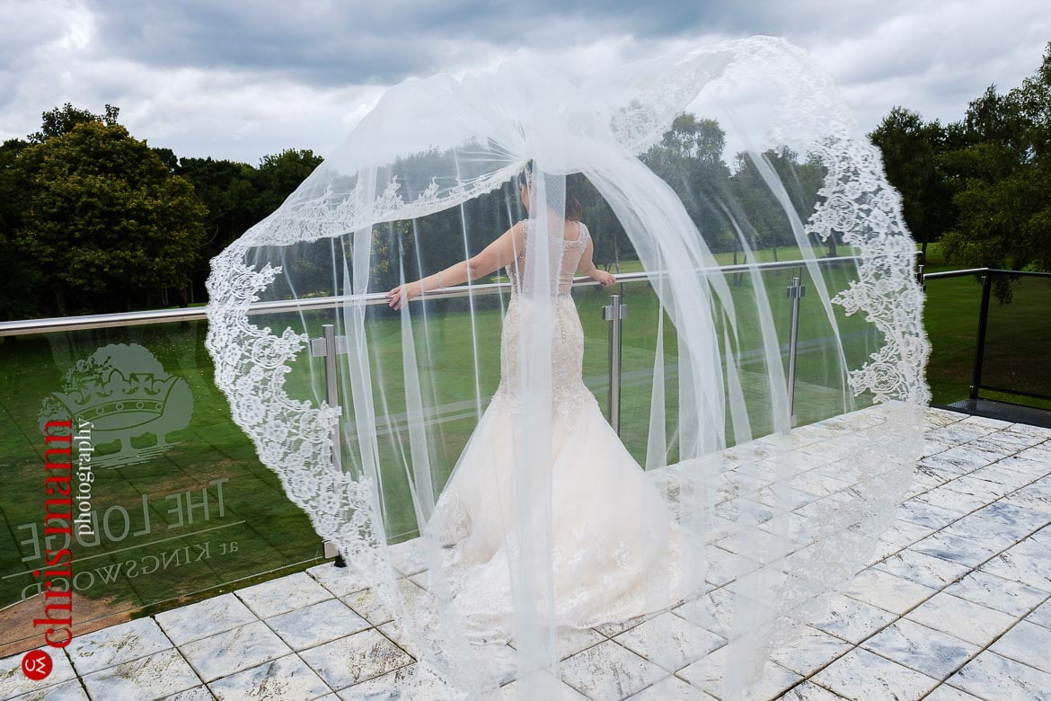Kingswood Golf Club Surrey wedding bride veil blowing in wind