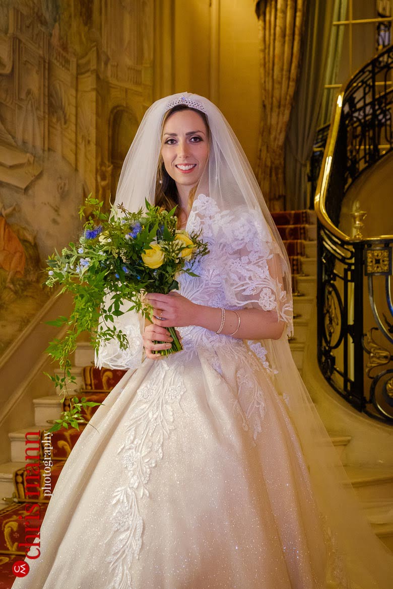 Posed wedding day portrait of gorgeous bride Michaela on the staircase - Ritz London wedding photography