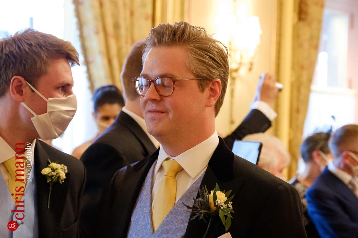 A moment of calm for the groom as he awaits his bride - Ritz London wedding photography